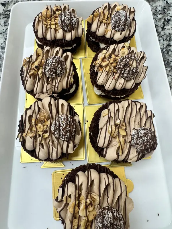 Chocolate mini cakes with coconut truffle and nuts