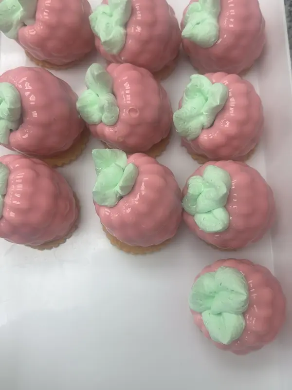 Raspberry mousse pastries on shortbread