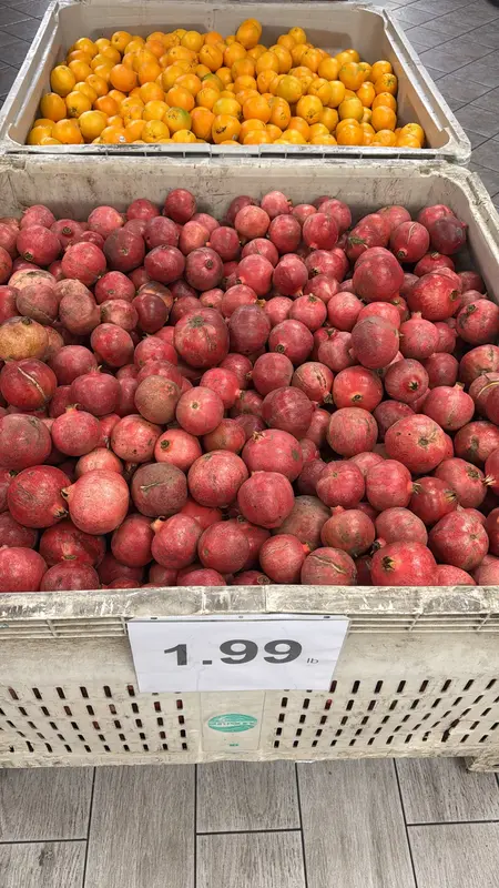 A bin of pomegranates